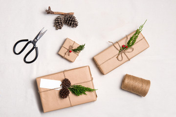 Christmas presents. Packages wrapped in kraft paper tied with ju
