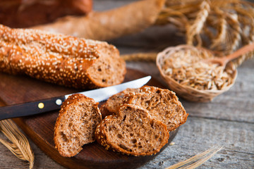 Sliced rye bread on a Board. On a wooden rustic table.