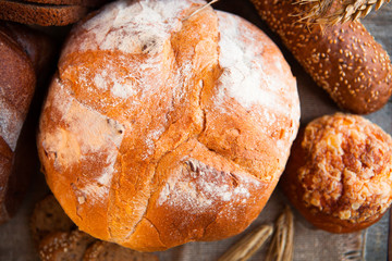 Close-up of traditional fresh bread on rustic table