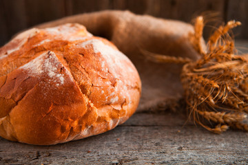 Close-up of traditional fresh bread on rustic table