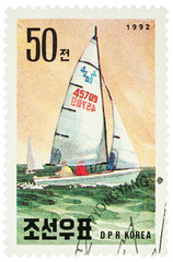 Fototapeta premium Sailing yacht on postage stamp