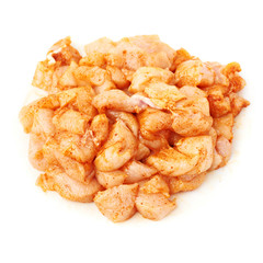 Raw chicken fillet cutted into pieces and spiced isolated over white background