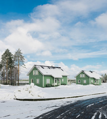 Fototapeta na wymiar Green houses in snow fairy forest.