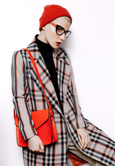 Young hipster Lady student. trendy Checkered vintage coat and be
