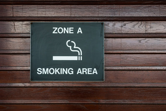 Designated Smoking area zone sign at an airport