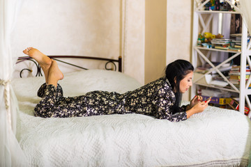 Woman lying in the bed