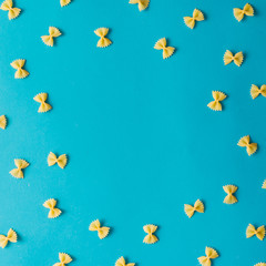 Naklejka na ściany i meble Pattern made of pasta on blue background.