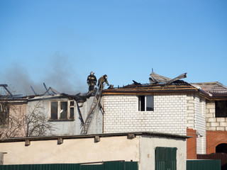Fototapeta na wymiar firefighters extinguish a fire