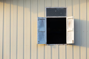 Obraz na płótnie Canvas Opening wooden window on woodenwall