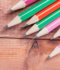 Sharpened pencils on wooden background. Close-up