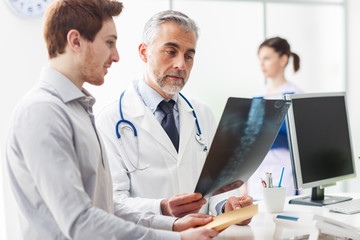 Doctor examining a patient's x-ray