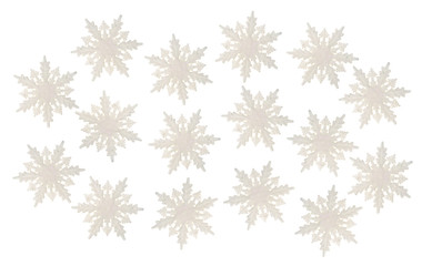 Group of plastic glitter snowflakes on a white background