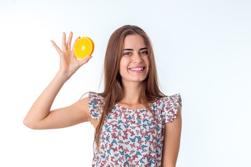 girl with orange slices in hands