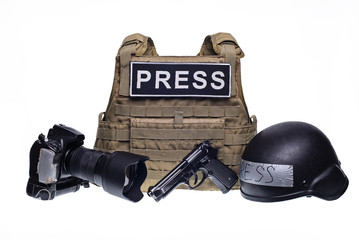 Bulletproof vest, camera, gun and helmet isolated/Bulletproof vest with patch PRESS, professional camera, gun and army helmet isolated on white background