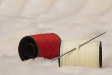 skein of colored thread and needle close-up