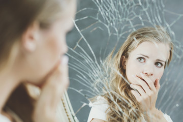 Girl and broken mirror