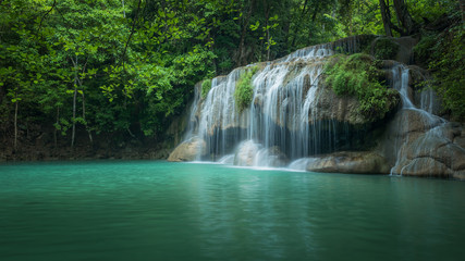 Fototapeta na wymiar Beautiful and Breathtaking waterfall, Erawan's waterfall, Located Kanchanaburi Province, Thailand