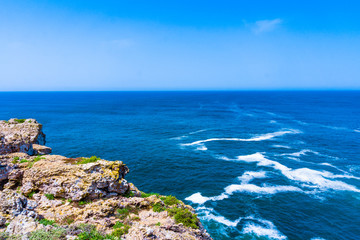 Ocean wave background. Cliff coastline in Sagres, Algarve, Portu