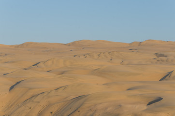 Fototapeta na wymiar Impressive towering Namib Desert sand dunes of Angola and Namibia