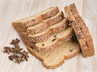 Wholemeal bread sliced on wooden table