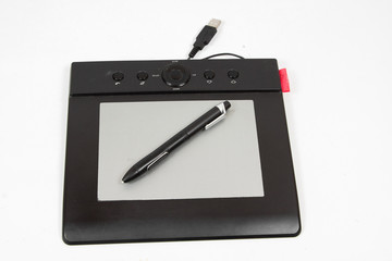 Digital, graphic tablet and pen isolated on white