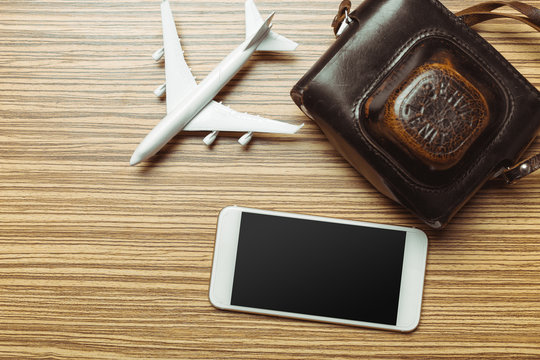 Preparation for Traveling concept. Smartphone, airplane