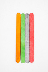 Colorful Ice Cream Sticks on White Background
