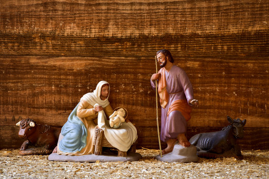the holy family in a rustic nativity scene