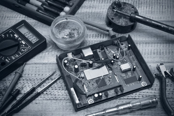 Workplace for repair of electronic equipment. Technological background.