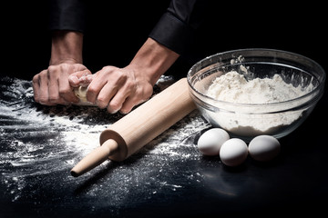 Close up of mans hands baking bread