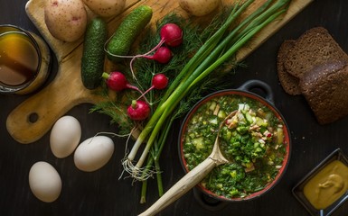 Okroshka — cold kvass soup with chopped vegetables and sausage