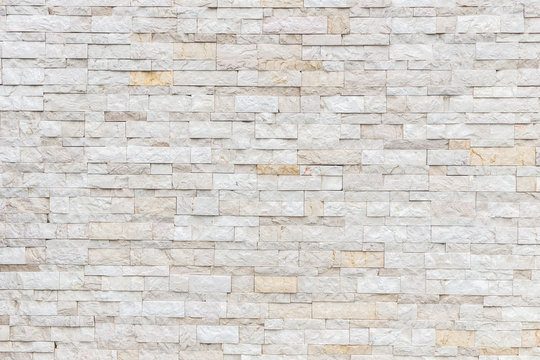 Pattern of grey and rough sandstone wall texture and background