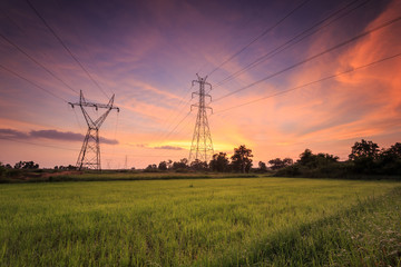 High voltage electric tower and beautiful sunrise