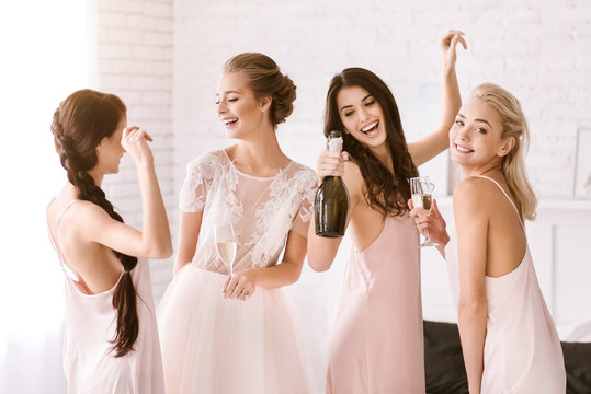 Laughing young girls having fun at home