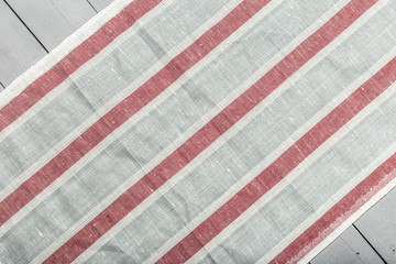 Fototapeta premium Tablecloth textile on wooden background