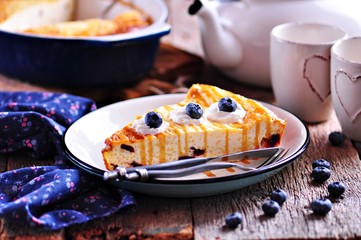 Cottage cheese casserole with couscous, dried cranberries, fresh organic blueberries and honey.