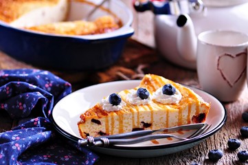 Cottage cheese casserole with couscous, dried cranberries, fresh organic blueberries and honey.