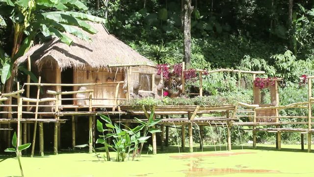 wooden hut with lake in public park Thailand