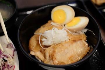 Pork with sweet sauce on top of rice bowl