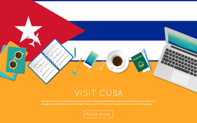 Visit Cuba concept for your web banner or print materials. Top view of a laptop, sunglasses and coffee cup on Cuba national flag. Flat style travel planninng website header.