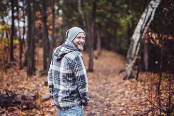 Young man in the autumn park