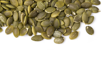 Pumpkin seeds on a white background.