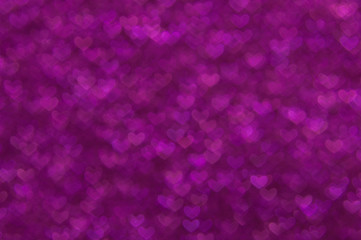 defocused abstract purple hearts light background