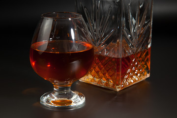 Glass of brandy and a carafe