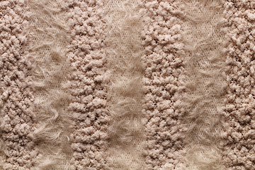 Background of warm women's sweater, with unusual patterns, warm and fluffy.