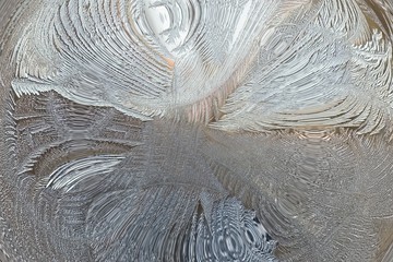 Abstract winter pattern of ice on glass
