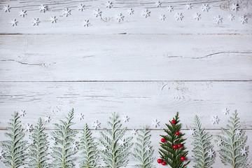 Christmas wooden background with snowflakes,  trees and forest