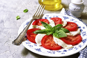Traditional italian salad caprese on a vintage plate.