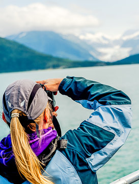 Traveler Taking a photo of a Glacier in Alaska