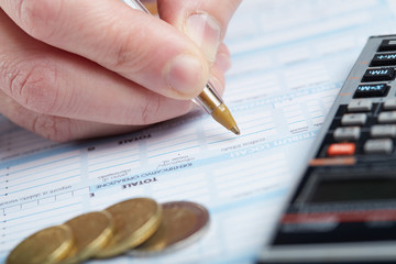 Businessman signing a tax document